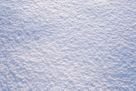 Snow surface close-up. Winter sunny day, frosty mood. Natural texture background. Copy space, top view.の写真素材