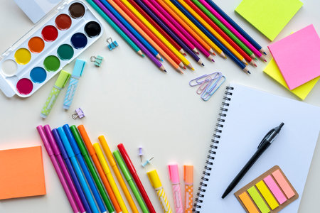 Pencils, paints, markers and other school stationery on a light gray background. Top view, flat lay, copy spaceの写真素材