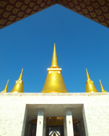 golden pagoda and blue sky at Nakhonprathom Province, Thailand の写真素材