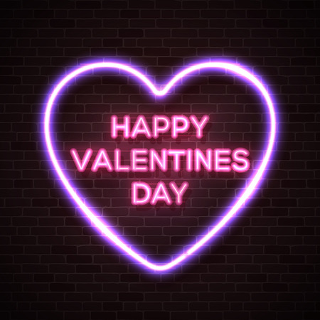 Happy Valentines Day neon lettering text in bright glowing electric heart shape frame. Street neon sign on dark brick wall background. Valentine's card with neon letters. 80s style vector illustrationのイラスト素材
