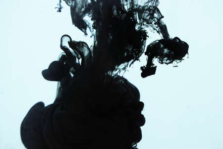 Acrylic black and white colors in water. Ink blot. Abstract backgroundの写真素材