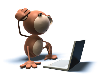 Cartoon monkey with a laptopの写真素材