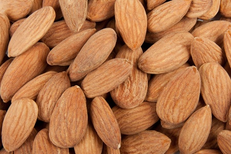 Fresh salted almonds texture background.の写真素材