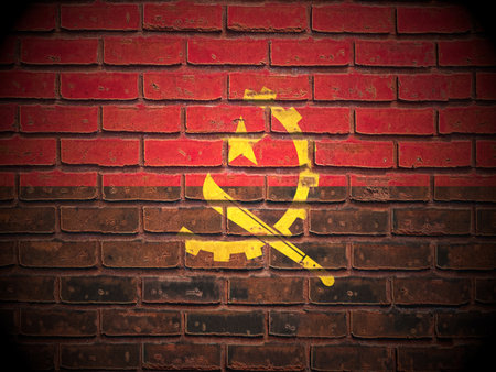 Old brick wall Angola flag background.の写真素材