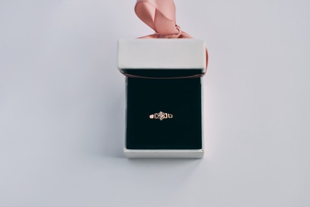Engagement ring in a white gift boxの写真素材