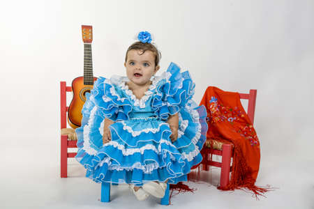 a baby dressed in flamenca dressの写真素材