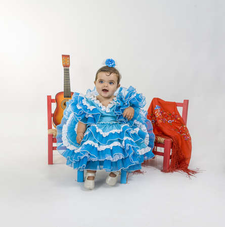 a baby dressed in flamenca dressの写真素材