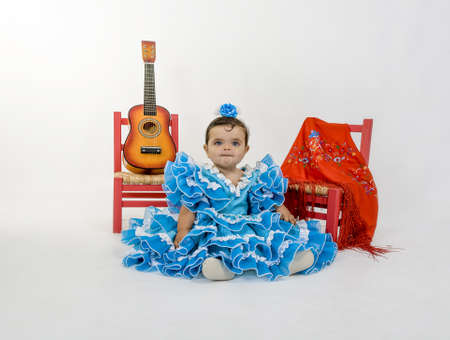 a baby dressed in flamenca dressの写真素材