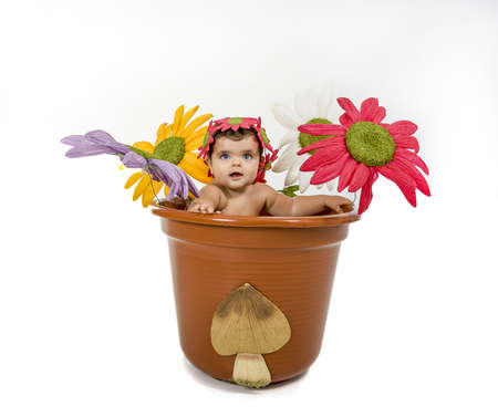 a baby dressed in a flower potの写真素材