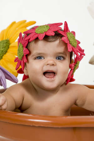 a baby dressed in a flower potの写真素材