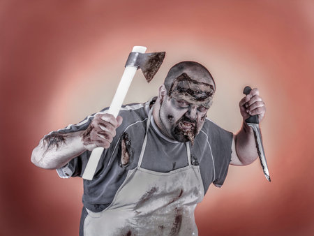 is a man dressed zombie one with butcher knives and axes