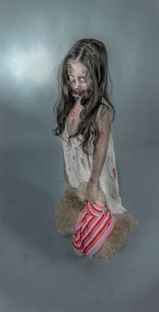 is a zombie girl dressed in a nightgownの写真素材
