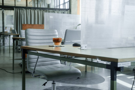 Co-working space with separated plastic boards between tables. new normal, maintain social...