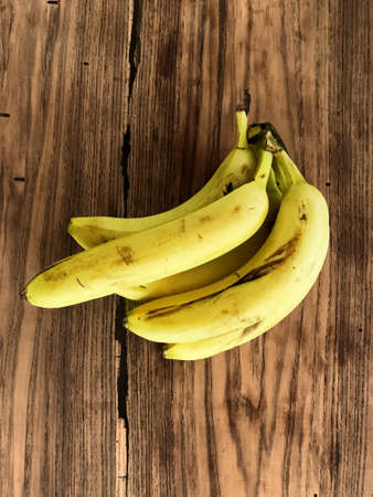 Bananas on a wooden tableの写真素材