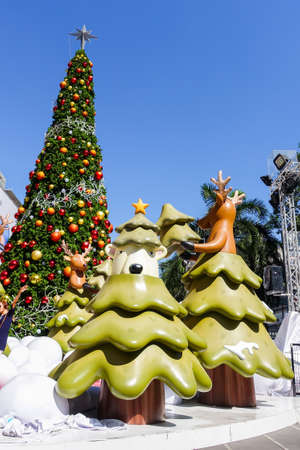 Bangkok, Thailand : December 3, 2017  Christmas Decoration with Christmas Tree, Santa Claus Sculpture, Reindeer and other cartoon characters in front of Central World Shopping Centerのeditorial素材