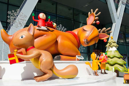 Bangkok, Thailand : December 3, 2017  Christmas Decoration with Christmas Tree, Santa Claus Sculpture, Reindeer and other cartoon characters in front of Central World Shopping Centerのeditorial素材