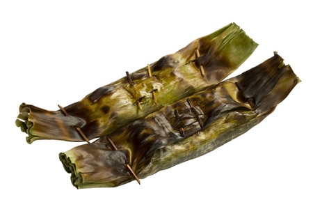 Grill rice wrap in banana leaf isolated on white backgroundの写真素材