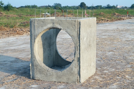 Concrete drainage tank on construction site の写真素材