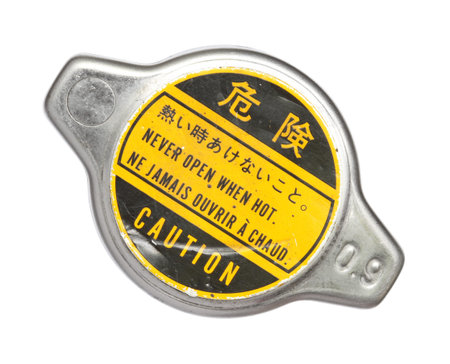Radiator cap with warning label isolated on white backgroundの写真素材