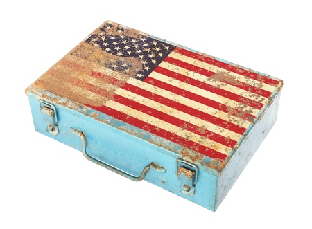 Rusty metal box with America flag on lid isolated on white backgroundの写真素材