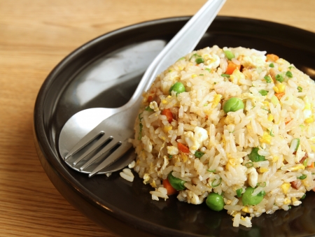 Fried rice in black dishの写真素材