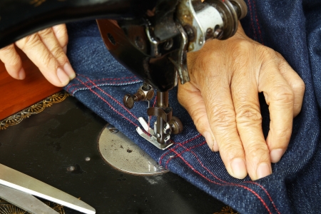 Hand sewing on a machineの写真素材