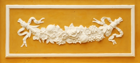 Vintage stucco of flower on the old buildingの写真素材