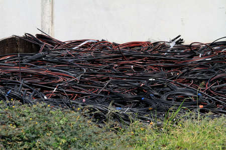 Pile of telecommunication wires fiber optic cables on industry siteの写真素材