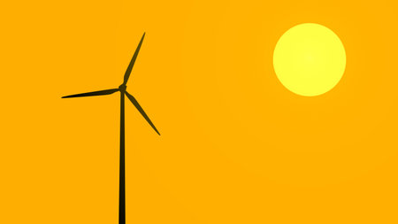 Silhouette of a wind turbine operating at sunset