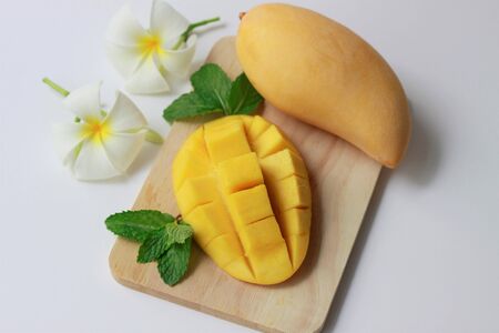Fresh yellow mangoes on wooden dish, Summer fruits, Fresh vitamins, Healtht foodの写真素材