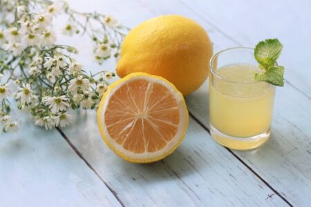 Fresh lemonade  with mint leaves and lemons on wooden bakground, Summer cocktails and drinksの写真素材