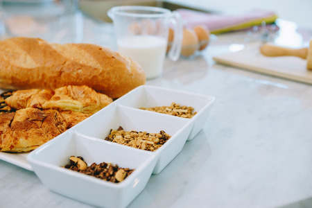 Whole grains for a bakery, put in a Cup, a box and placed on a table in the kitchen, in a  beautiful house.の写真素材