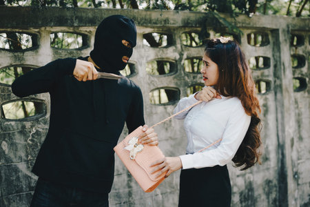 Thieves were threatened with a knife office girl on the way she was walking home.