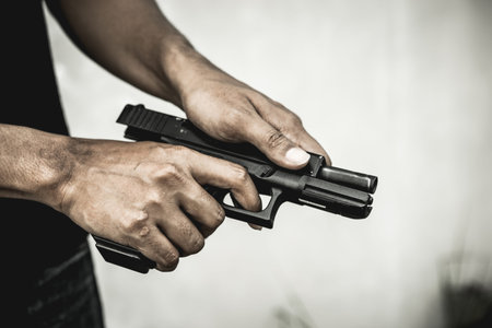 A man holding a gun in hand, the ship ready to shoot the man pointed a gun at us. A man holding a...