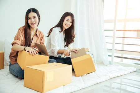Young asian girls are freelancer with her private business at home office, working with laptop,  online marketing. Young woman startup her SME business.の写真素材
