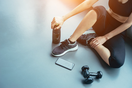 Asian woman exercising in the gym, Young woman workout in fitness for her healthy and office girl lifestyle.の写真素材
