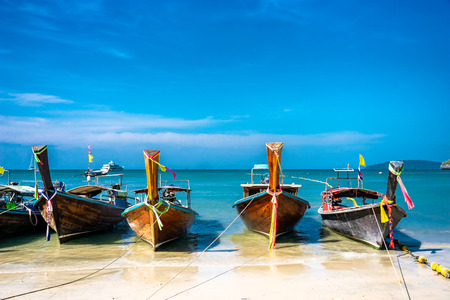 Long tail boat on the tropical white sand beach at Krabi, Thialand.の写真素材