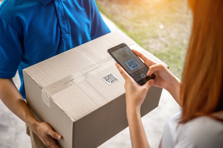 A young Asian deliveryman is delivering a package of women in front of her house. And asked her to...