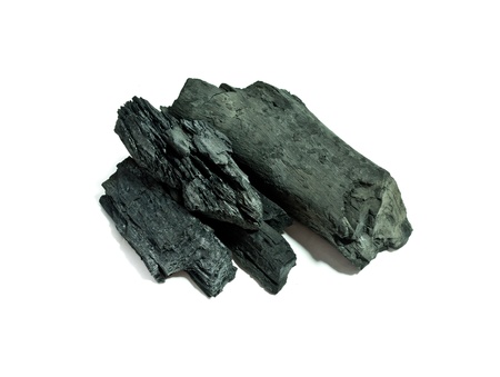 Lumps of charcoal on white  backgroundの写真素材