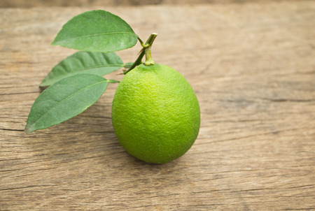 Fresh citrus lime  on wooden backgroundの写真素材
