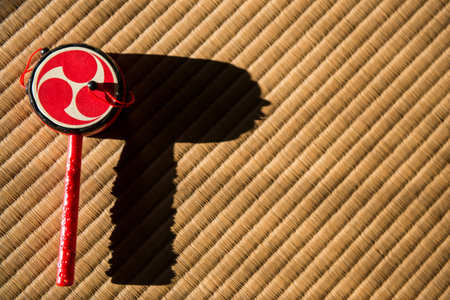 Japanese toy drum on tatami mat background
