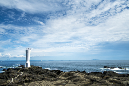 Horizon of the sea ocean, lighthouse and blue sky backgroundの写真素材