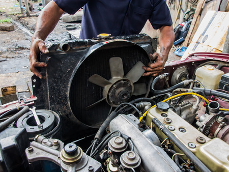Repairing a car's radiator repairの写真素材