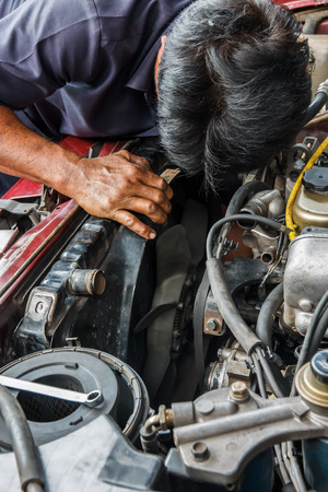 Repairing a car's radiator repairの写真素材