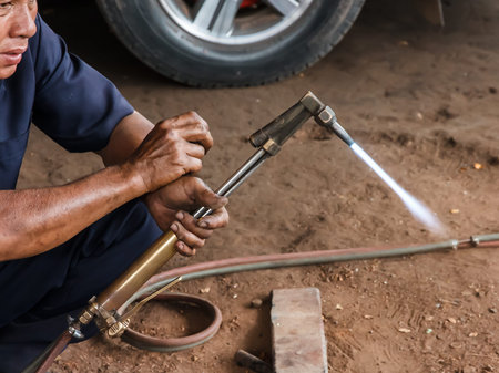 worker cutting steel pipe using metal torch .