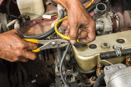 Repairing the engine hose clamp.