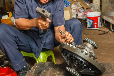 Professional car mechanic working in auto repair service.の写真素材