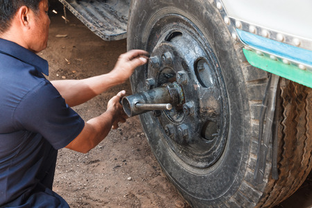 Professional car mechanic working in auto repair service.の写真素材