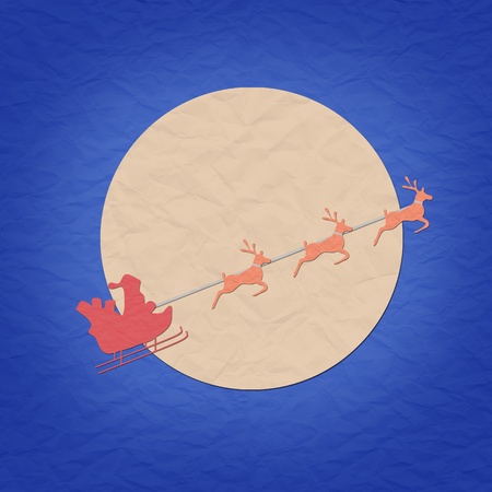 Santa on sledge with raindeer and moon paper craft の写真素材