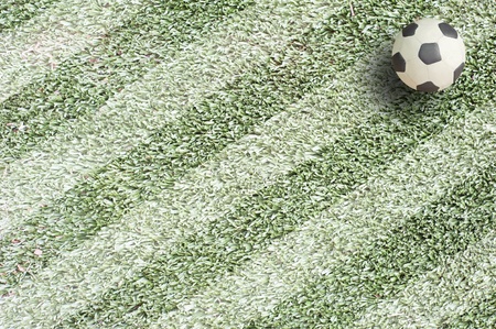 Plasticine Football on grass background の写真素材